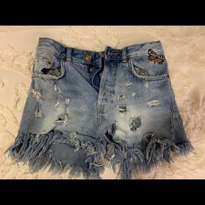 Ripped denim shorts